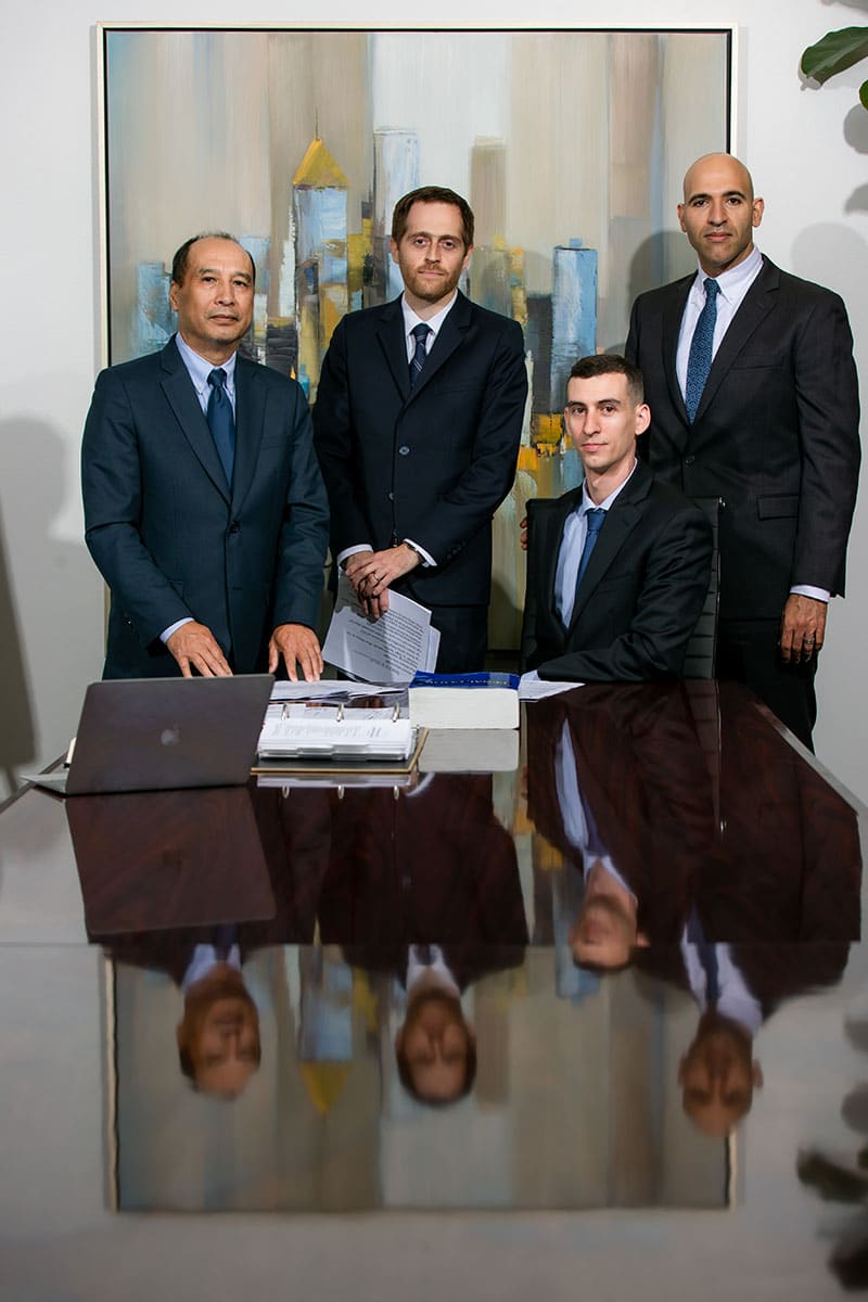 Attorneys Don Nguyen, Aaron Spolin, and Jeremy Cutcher, and legal researcher Dan DeMaria | Spolin Law P.C.