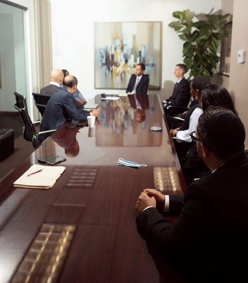 Spolin Law P.C. legal team discussing with a client