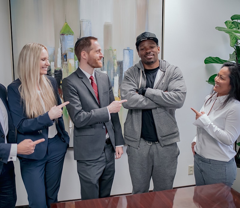 Some of the Spolin Law attorneys and staff celebrate with the client days after he is released from prison. Pictured (left to right): Caitlin Dukes (attorney), Aaron Spolin (attorney), R.H. (client), Hemi Tann (Case Manager).