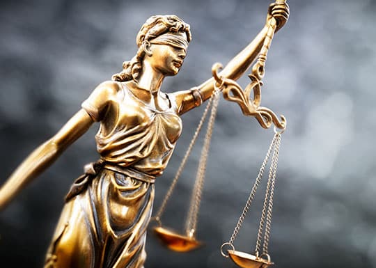 Lady Justice Holding Scales | Spolin Law